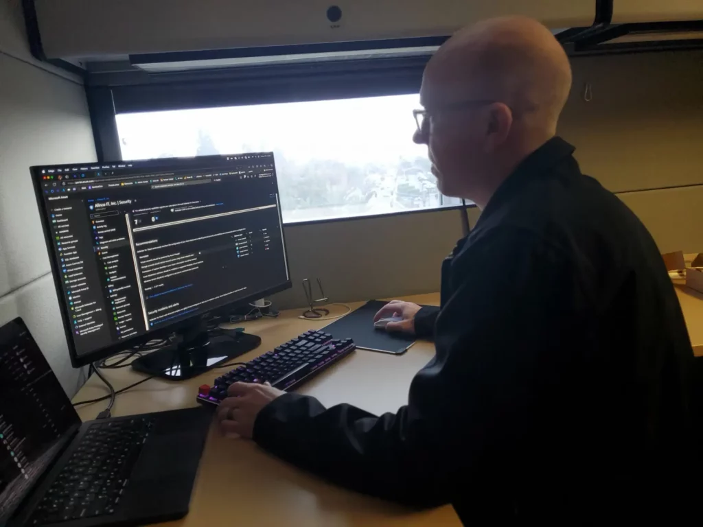 Alinco worker on computer