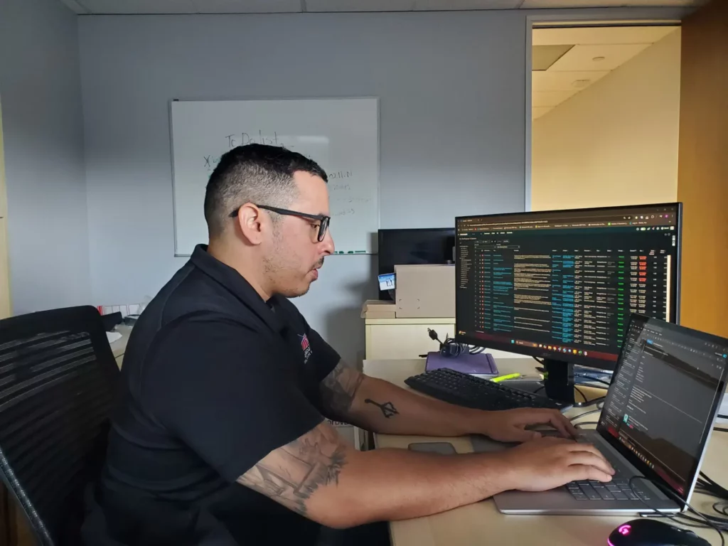 alinco worker on computer